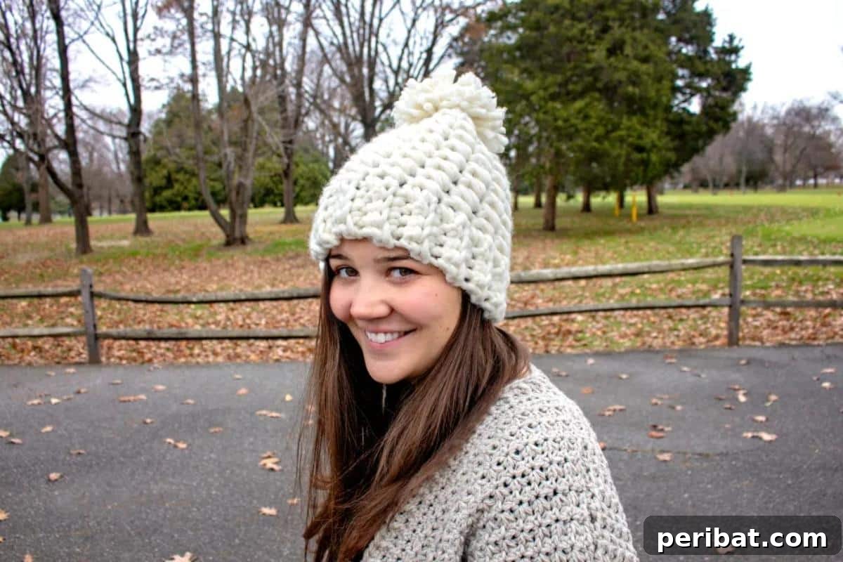 26 Quick & Cozy Chunky Crochet Projects 18 A vibrant Snowdrift Hat with a fluffy pom-pom, designed to provide warmth and style for winter sports.