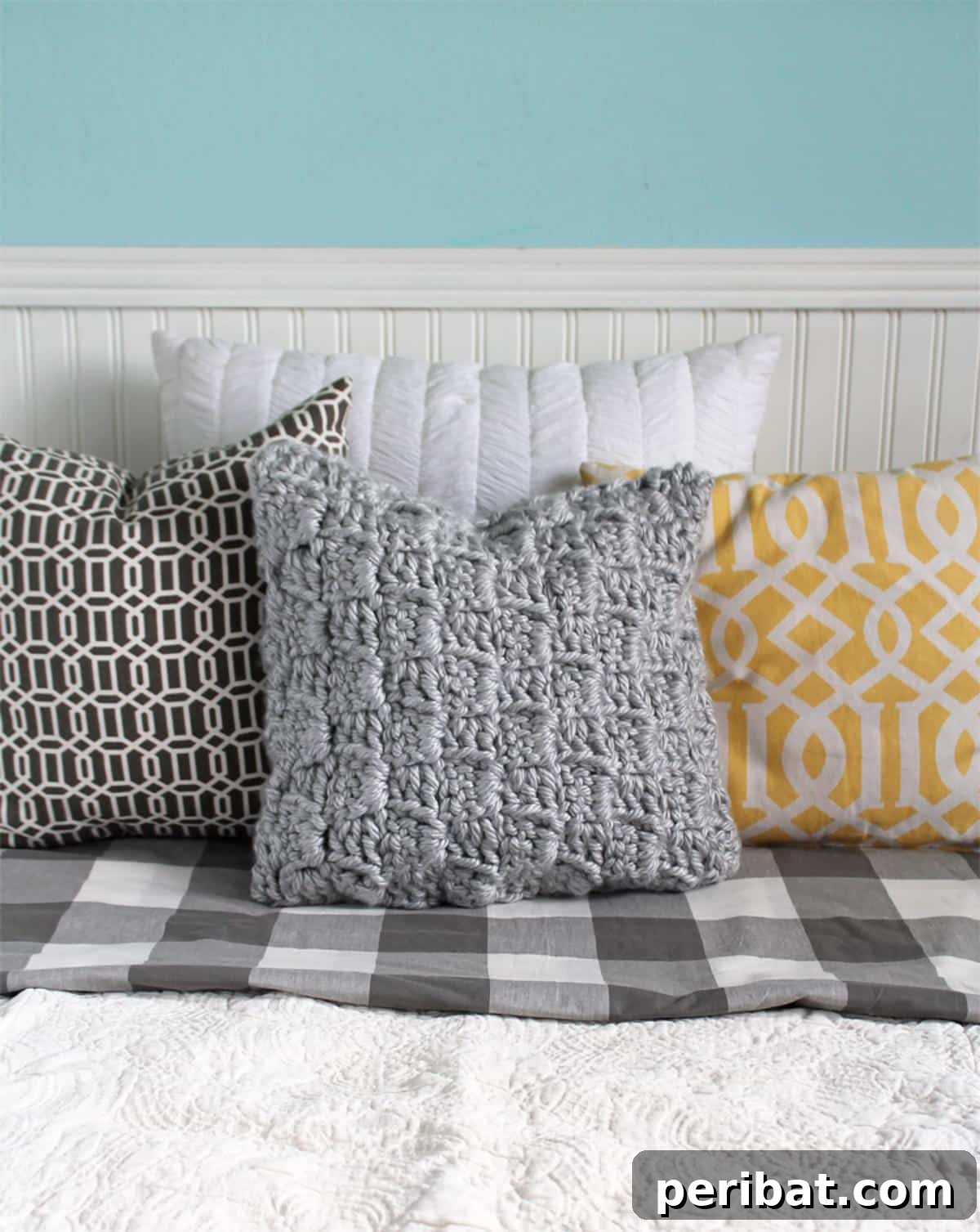 26 Quick & Cozy Chunky Crochet Projects 20 A unique Chunky Stairstep Throw Pillow, showcasing its distinct textured steps and comforting design.