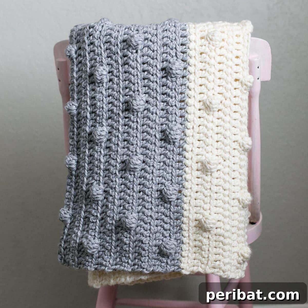26 Quick & Cozy Chunky Crochet Projects 22 A textured Chunky Bobble Blanket, featuring raised bobble stitches for an incredibly cozy and inviting feel.