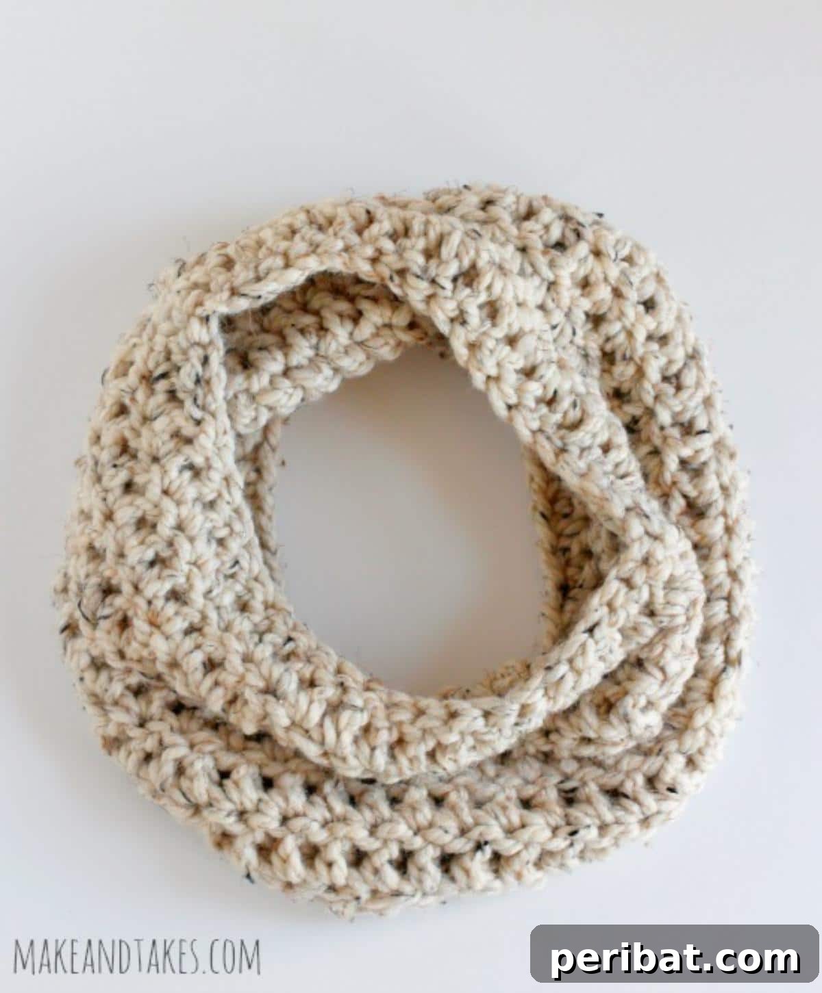 26 Quick & Cozy Chunky Crochet Projects 23 A model wearing a Cold Weather Chunky Crochet Cowl, demonstrating its warmth and stylish drape around the neck.