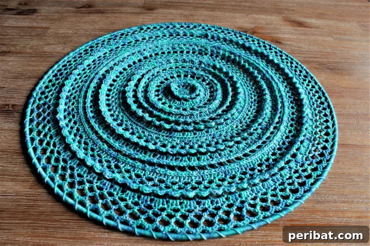 26 Quick & Cozy Chunky Crochet Projects 27 A stunning Ripple Effect Crochet Mandala, featuring intricate patterns and vibrant colors, ideal as a centerpiece.