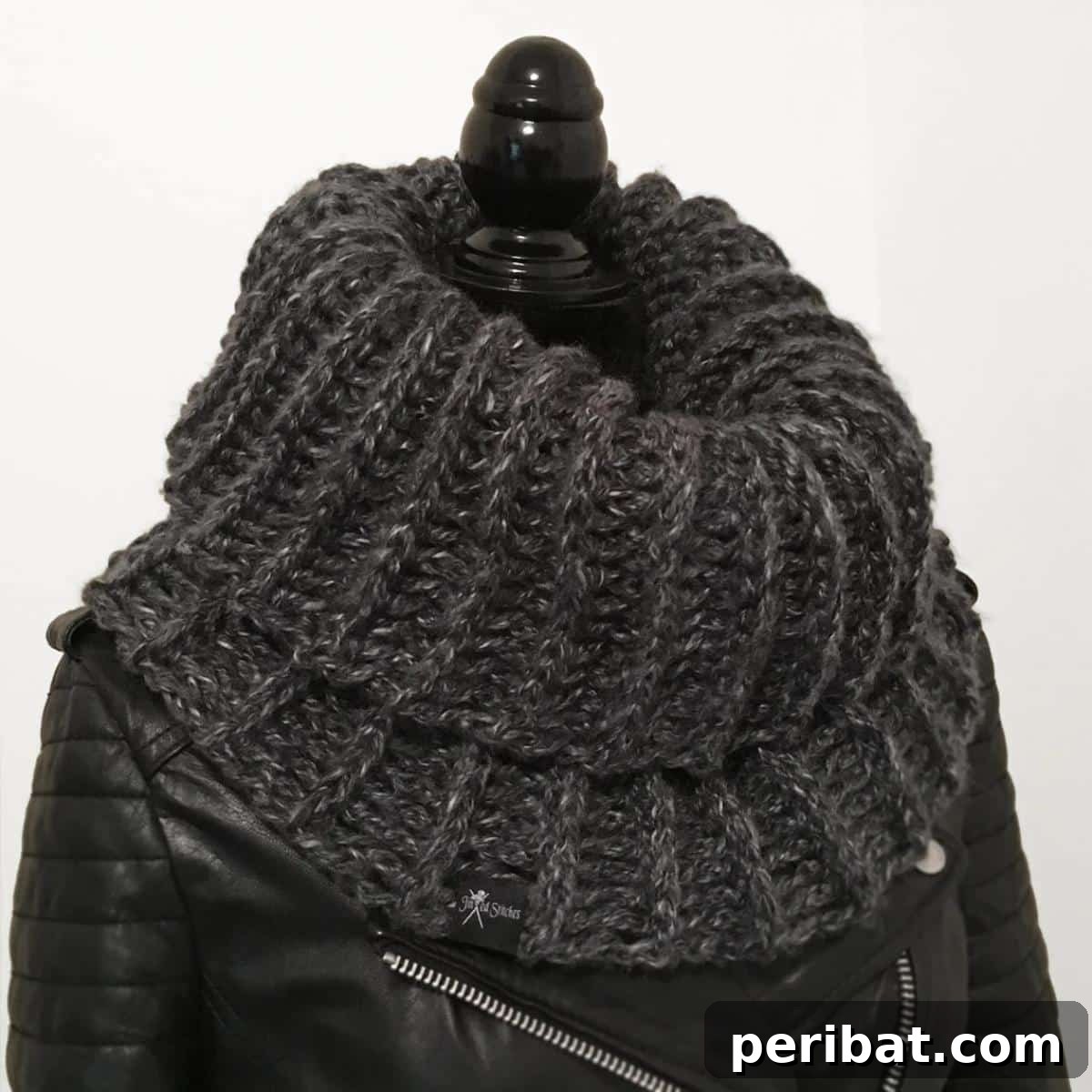 26 Quick & Cozy Chunky Crochet Projects 28 A model wearing a Simple Ribbed Cowl Scarf With Chunky Yarn, highlighting its cozy texture and stylish drape around the neck.