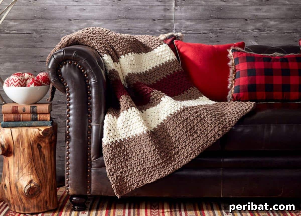 26 Quick & Cozy Chunky Crochet Projects 7 A beautifully textured Bernat Hibernate Crochet Blanket in a neutral color palette, ideal for modern home decor.