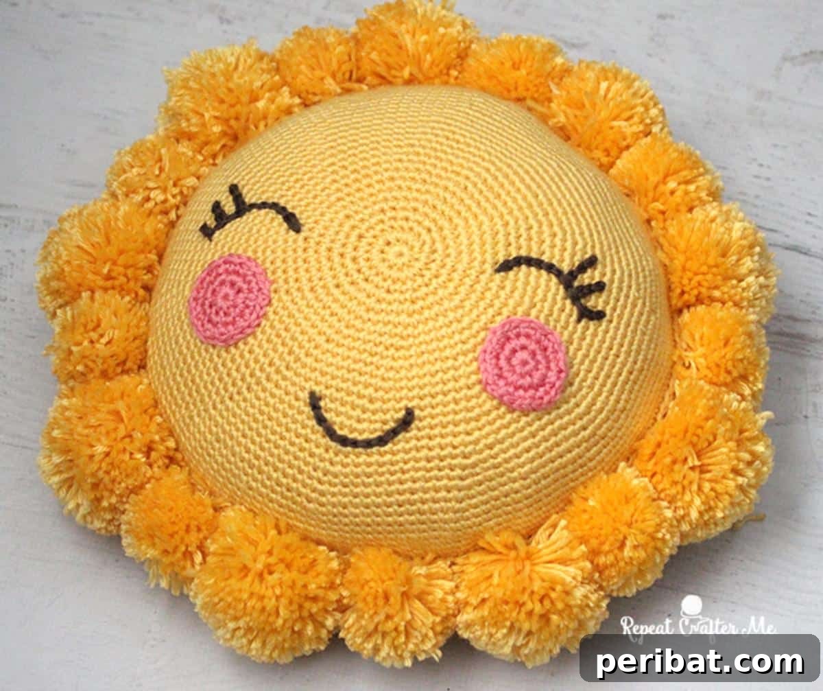 40 Creative Crochet Pillow Projects 11 A cheerful Pompom Sunshine Pillow, designed with bright yellow yarn and adorned with fluffy white pompoms resembling sun rays.