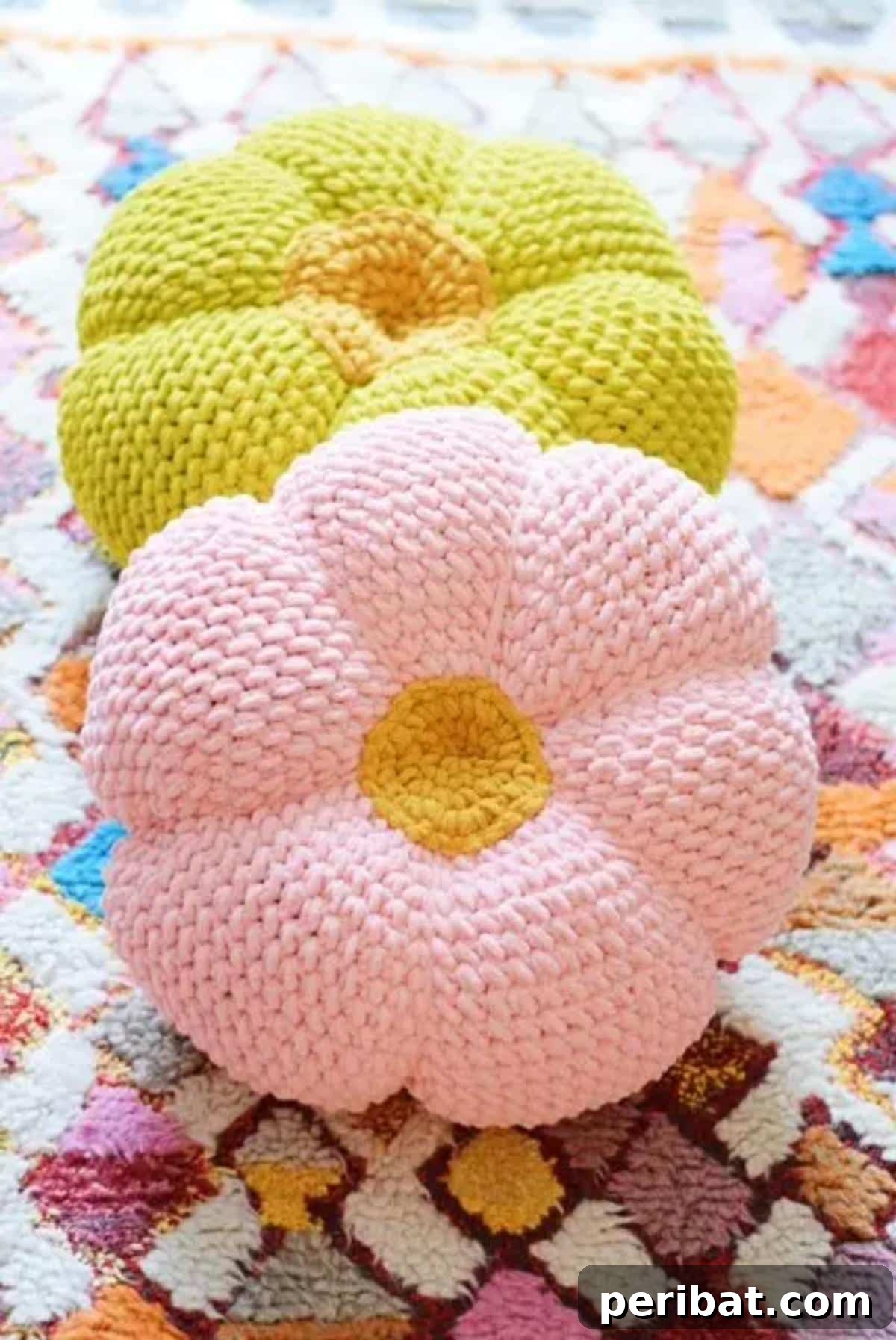 40 Creative Crochet Pillow Projects 16 A cheerful retro throw pillow, featuring a vibrant daisy-like design in super bulky yarn, perfect for adding a nostalgic touch to home decor.