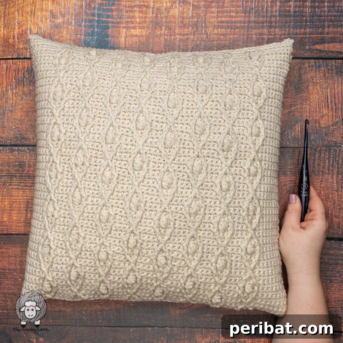 40 Creative Crochet Pillow Projects 27 A robust crochet throw pillow, made with bulky yarn to create a dense, textured fabric without gaps, suitable for modern farmhouse decor.