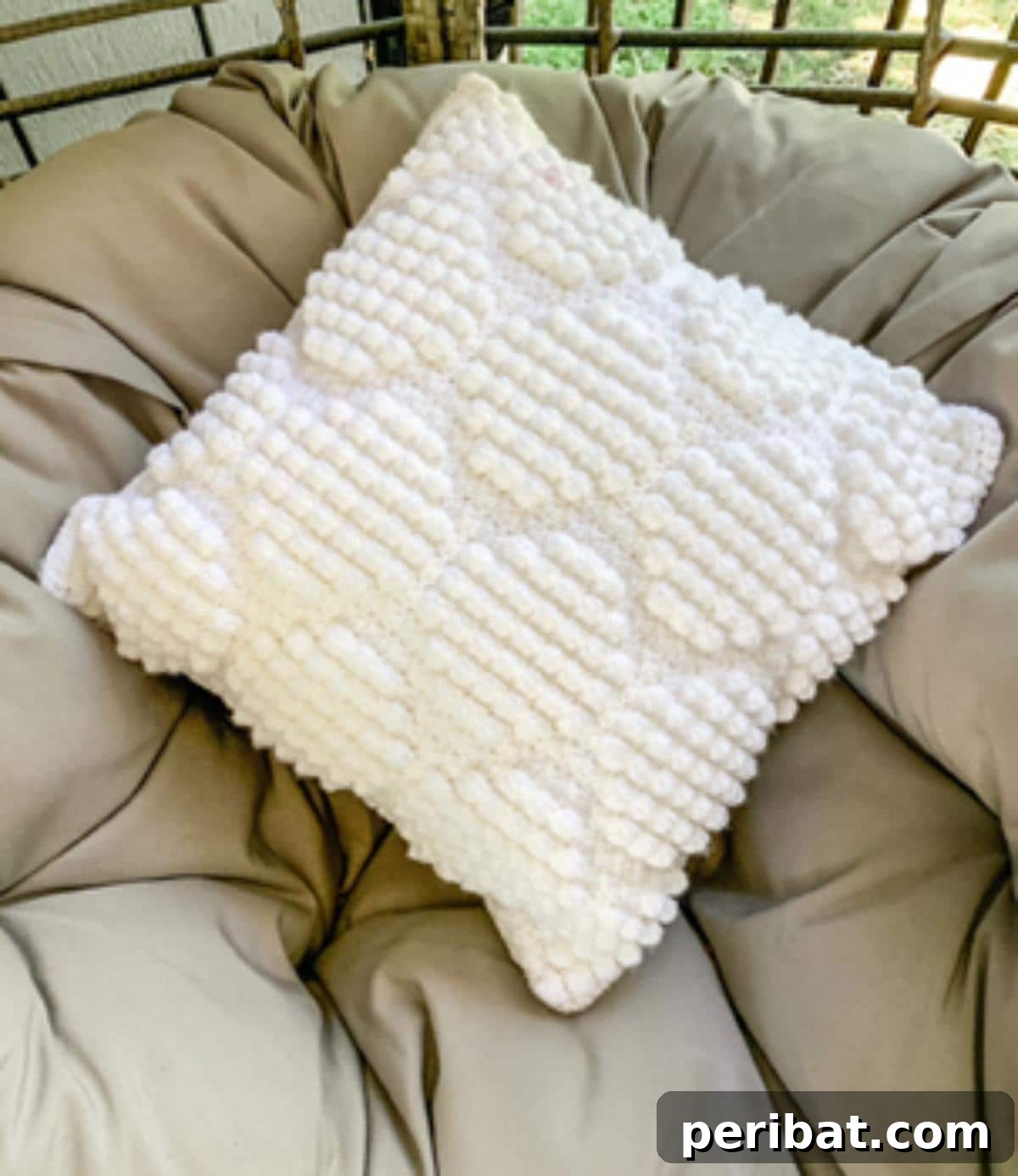 40 Creative Crochet Pillow Projects 32 A modern octagon bobble crochet pillow, featuring a striking geometric shape and rows of textured bobble stitches, ideal for contemporary living spaces.