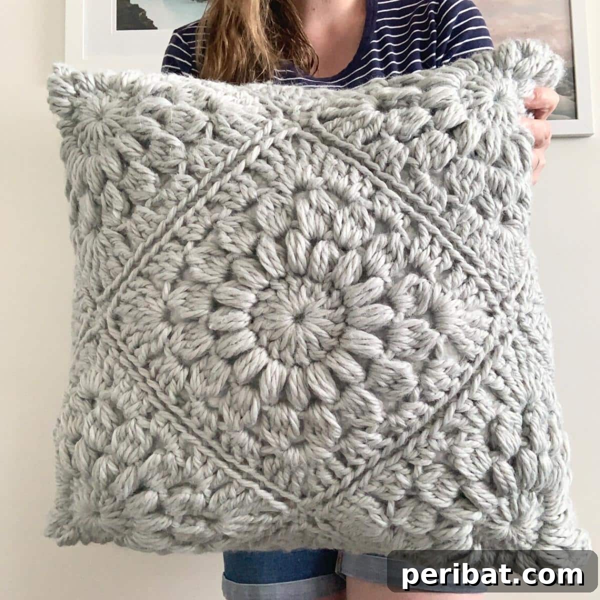 40 Creative Crochet Pillow Projects 39 A cheerful Sunburst Pillow, crafted with chunky yarn and a radiating sunburst design, perfect for adding warmth and a cozy aesthetic.