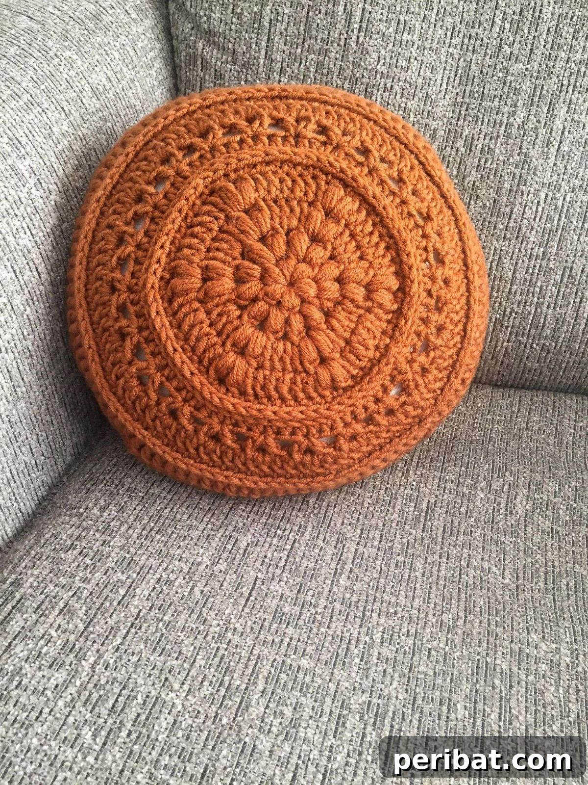 40 Creative Crochet Pillow Projects 5 A vibrant flower power circular crochet pillow, featuring colorful petals and a cheerful, retro-inspired design.