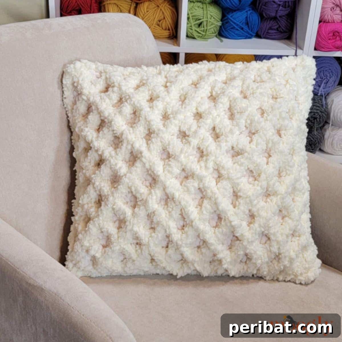 40 Creative Crochet Pillow Projects 6 A luxurious fluffy diamond crochet pillow, made with plush yarn to create a soft, textured surface with a raised diamond pattern.