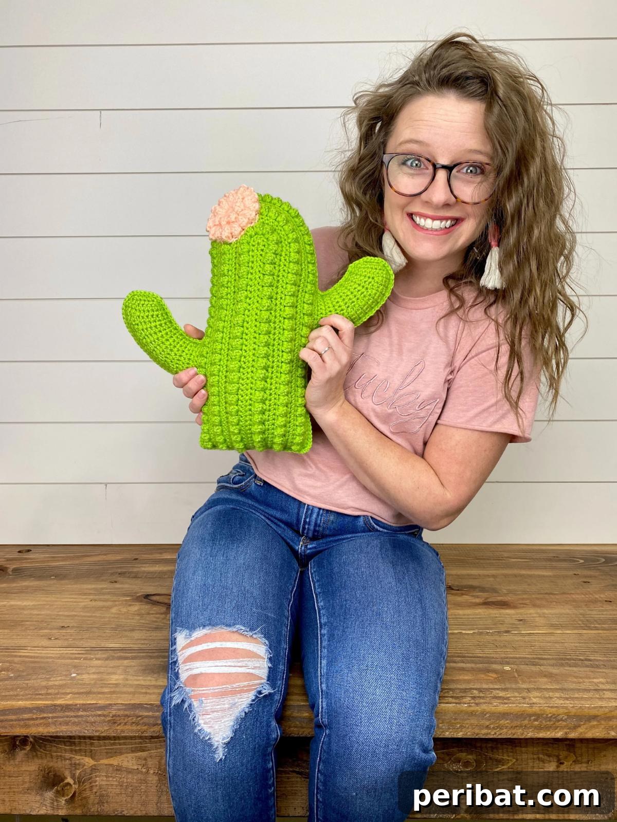 40 Creative Crochet Pillow Projects 8 A charming crochet cactus pillow, designed in a succulent shape with textured details, offering a unique and low-maintenance botanical accent.
