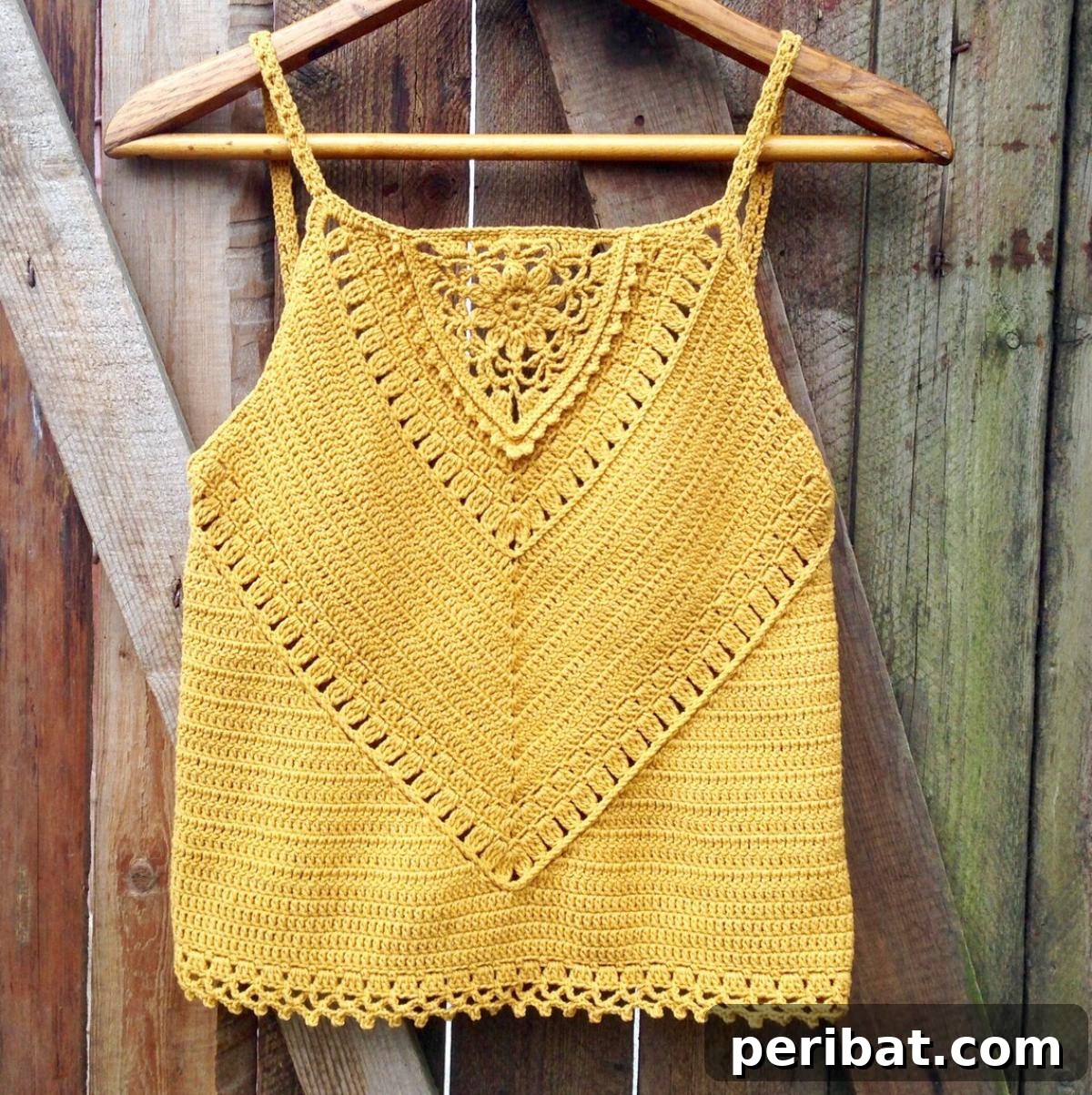 Elegant Veronica Sleeveless Tank Top with flower motif and V-pattern for a flattering figure.