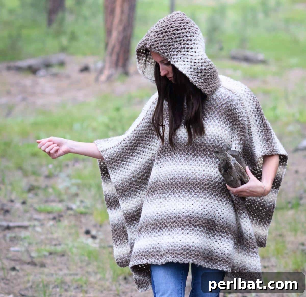 Driftwood Oversized Crochet Hooded Poncho, featuring a cozy hood and stylish fringe for a boho-chic look on chilly days.