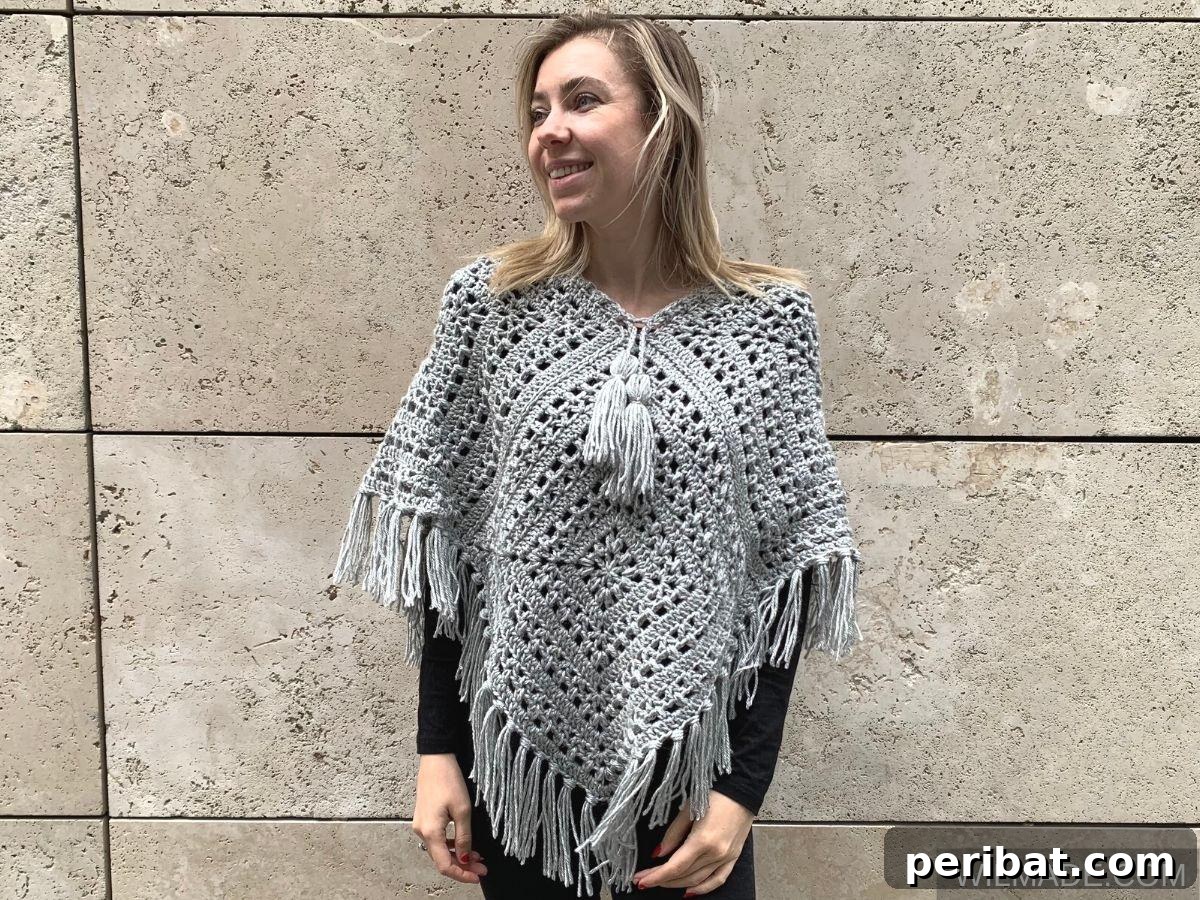 Tulip Square Poncho, an intricate crochet design featuring beautiful tulip square motifs, ideal for detailed work.