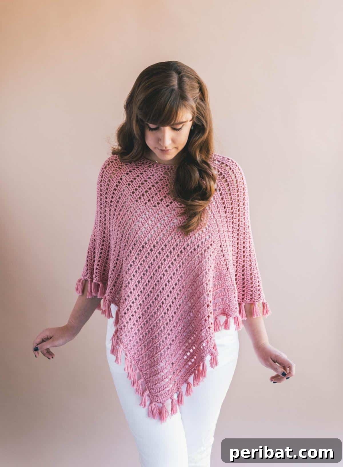 Crochet Ava Fringed Poncho, featuring a stylish fringe detail for a flowy and romantic bohemian aesthetic.