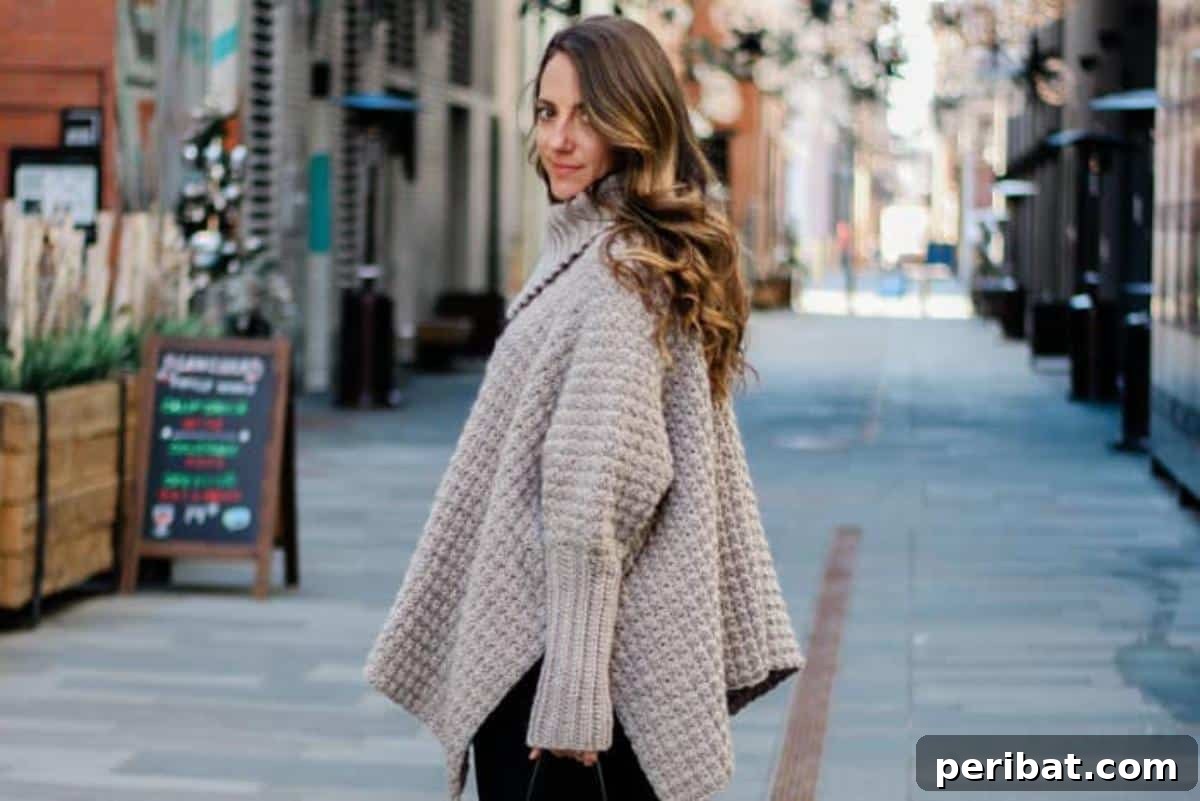 Cozy Crochet Sweater Poncho with Sleeves, combining the comfort of a sweater with the stylish drape of a poncho.