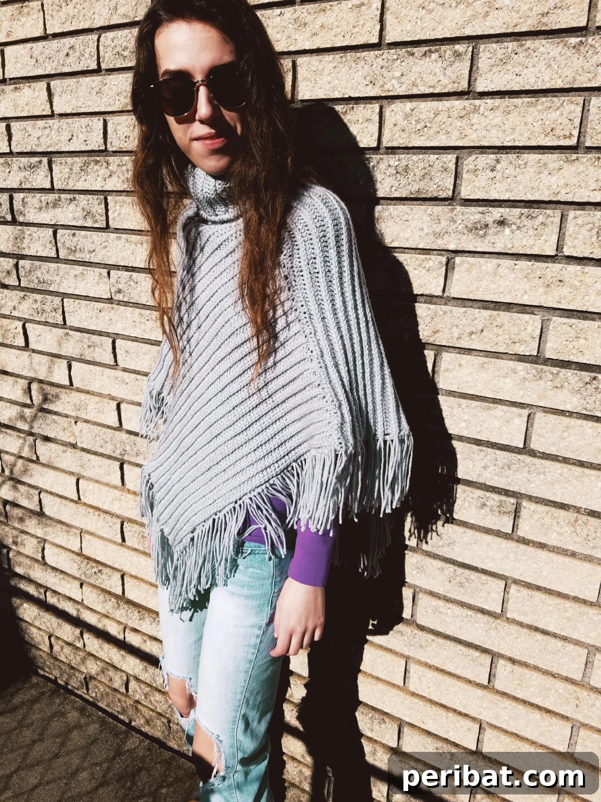 The Nicole Knit Look Crochet Poncho, offering the sophisticated appearance of knitting created entirely with crochet stitches.