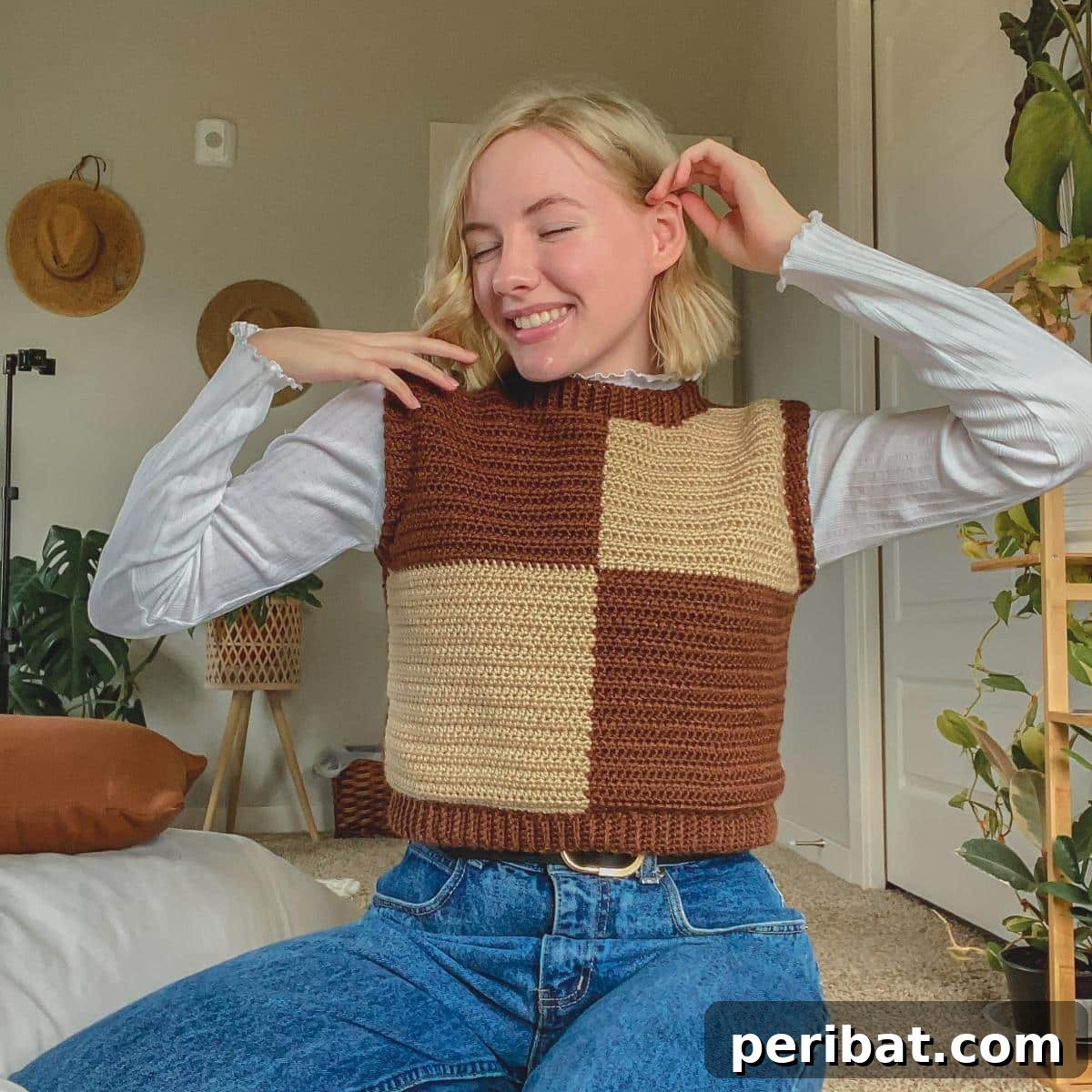 40 Chic Crochet Vest Designs 11 Crochet Checkerboard Sweater Vest - A trendy and modern free pattern with a video tutorial, perfect for adding a geometric pop to any outfit.