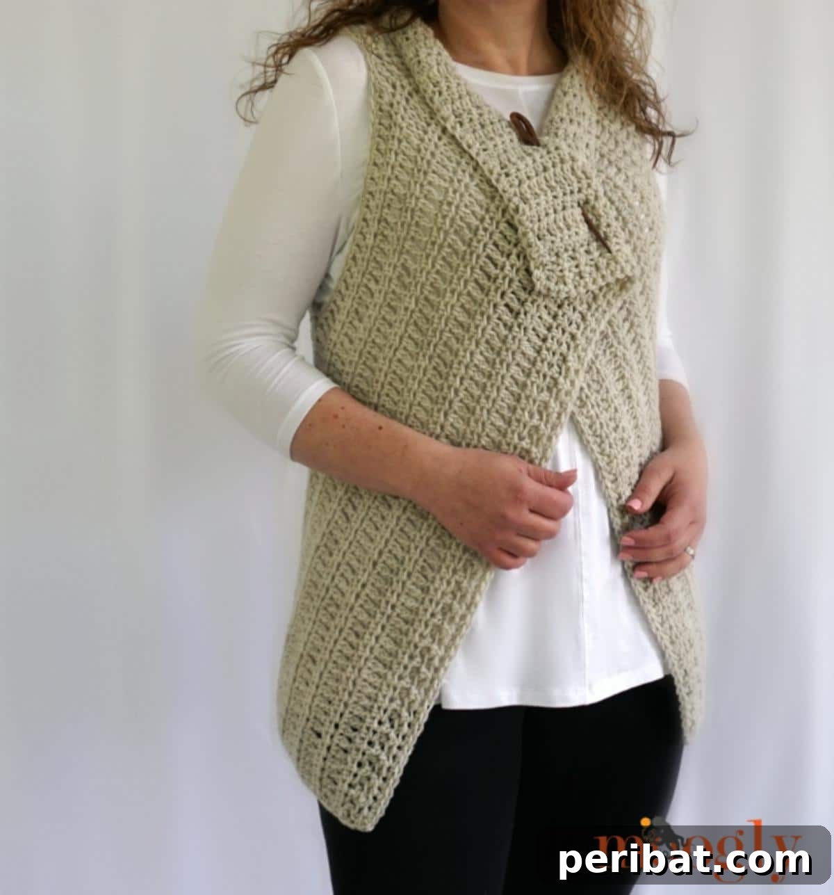 40 Chic Crochet Vest Designs 13 Simple Waterfall Vest - An elegant and flowing crochet vest design, achieved through a clever combination of stitches for a beautiful drape.