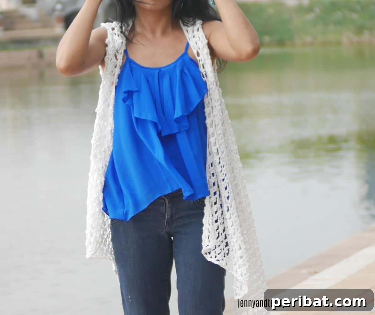40 Chic Crochet Vest Designs 23 Lacy Crochet Summer Vest - A perfect lightweight and lacy summer accessory that adds a touch of feminine charm.