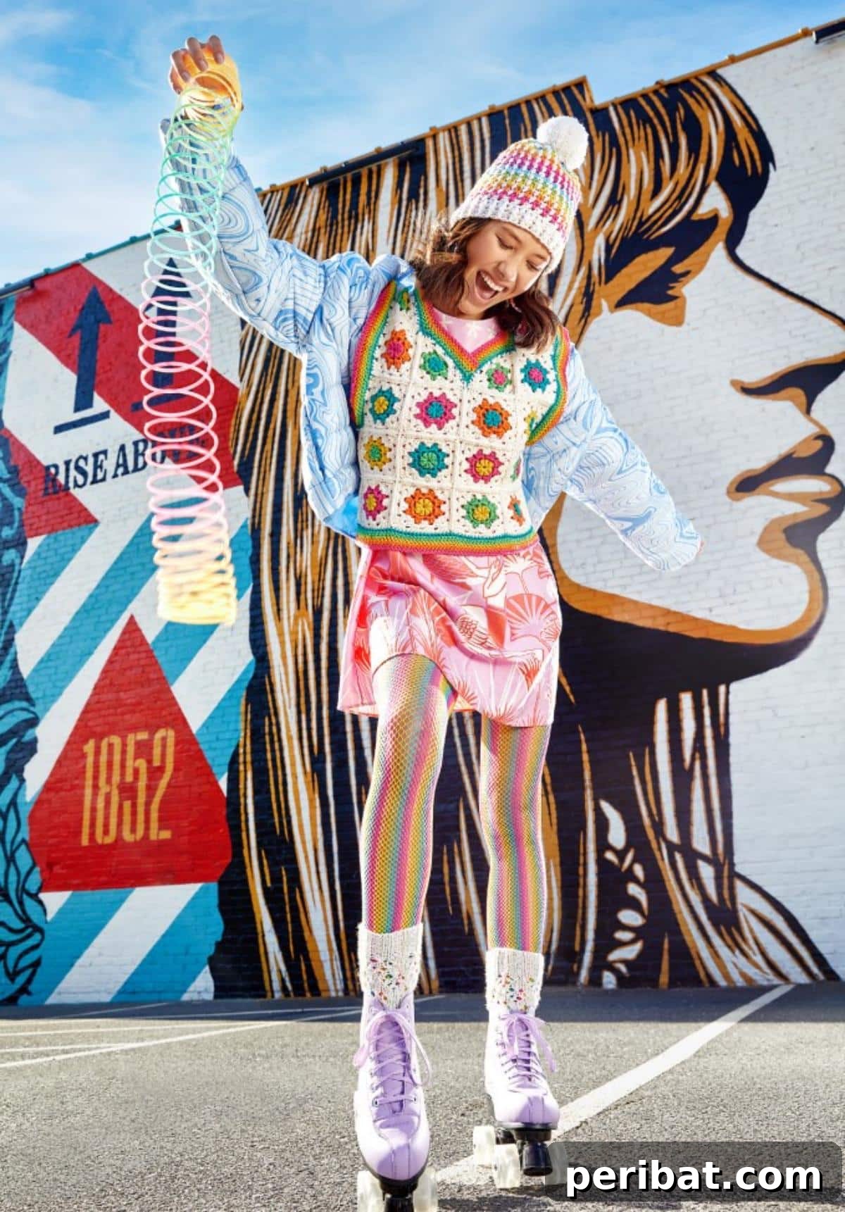 40 Chic Crochet Vest Designs 24 Rainbow Granny Vest - A vibrant and cheerful crochet vest featuring classic granny squares in a rainbow of colors, perfect for showcasing crochet skills.