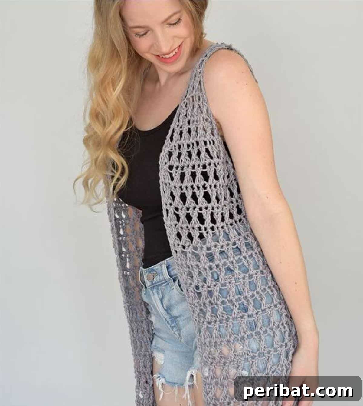 40 Chic Crochet Vest Designs 25 Crossroads Crochet Vest - A standout design with a unique crossroads pattern, featuring intersecting lines for visual interest.