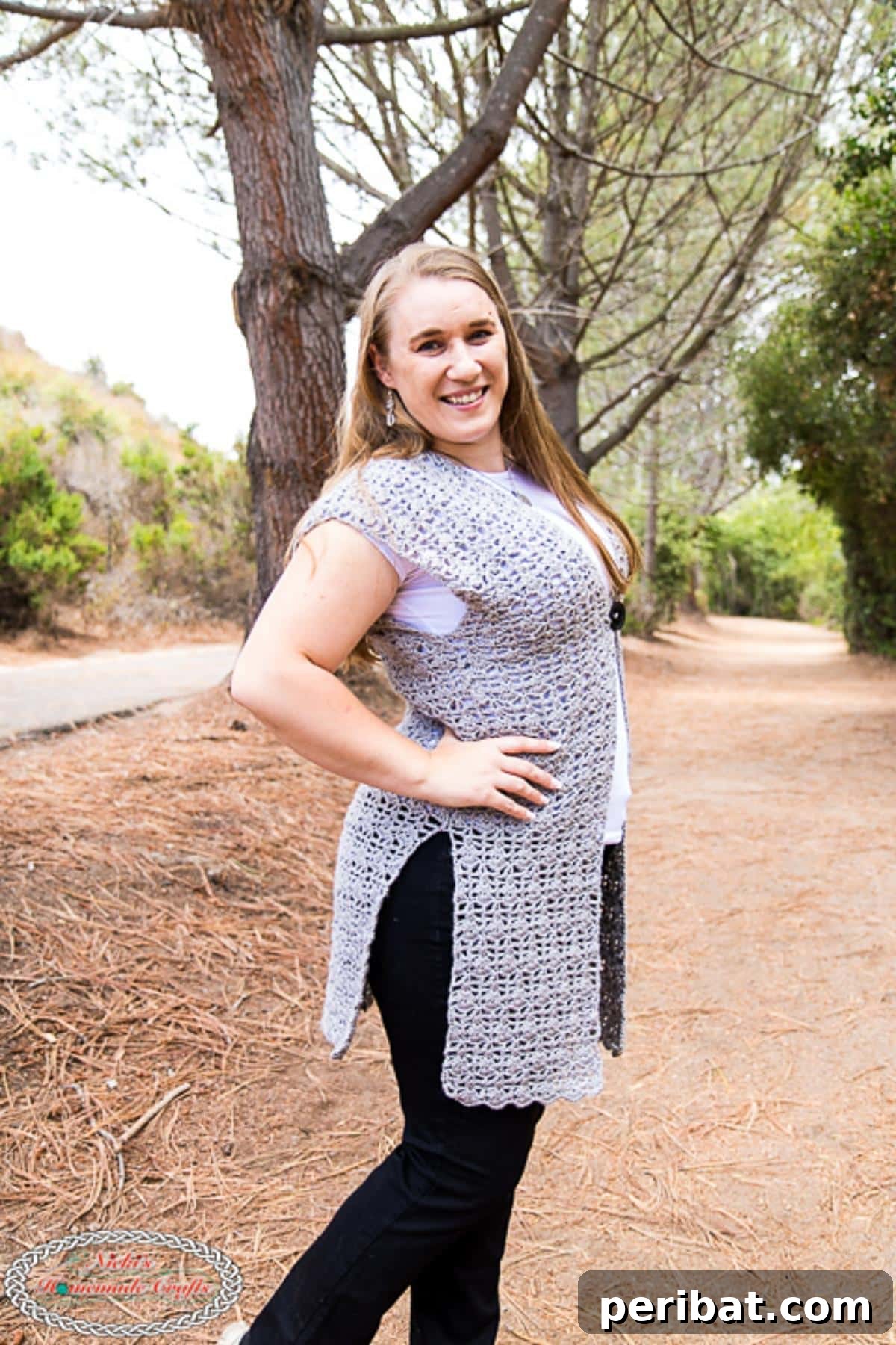 40 Chic Crochet Vest Designs 30 Easy Long Crochet Vest - A lacy, shell stitch pattern that's easy to follow and suitable for beginners, creating a flowing and elegant garment.