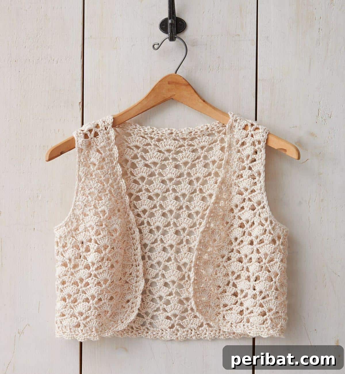 40 Chic Crochet Vest Designs 4 Patons Seashell Crochet Vest - A delicate and feminine summer vest featuring a unique seashell stitch pattern.