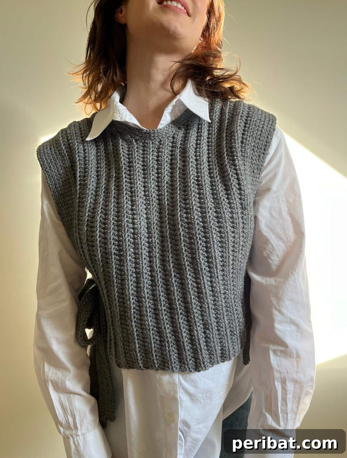 40 Chic Crochet Vest Designs 40 Classy Gray Vest - A sophisticated crochet vest pattern in a versatile gray hue, combining style and practicality for a polished look.