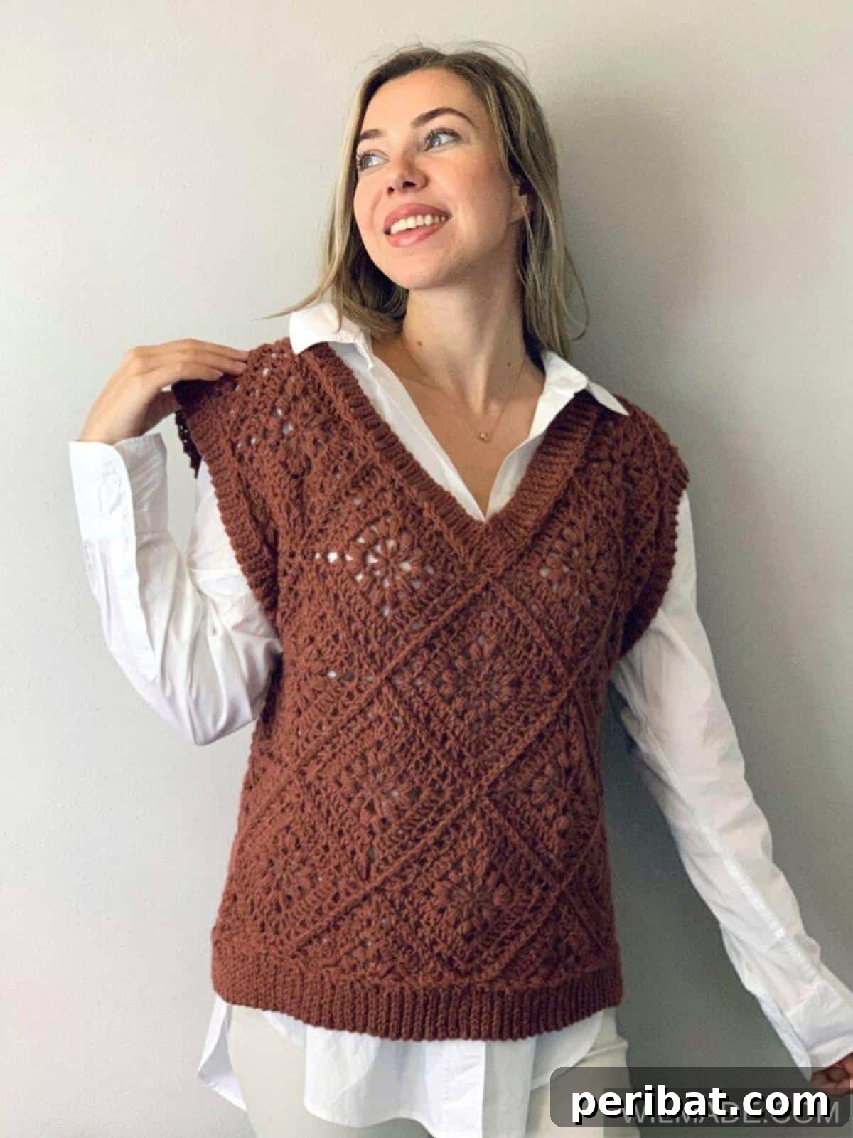40 Chic Crochet Vest Designs 5 Tulip Square Vest - A chic and unique crochet vest constructed from a single large, eye-catching tulip-inspired square motif.