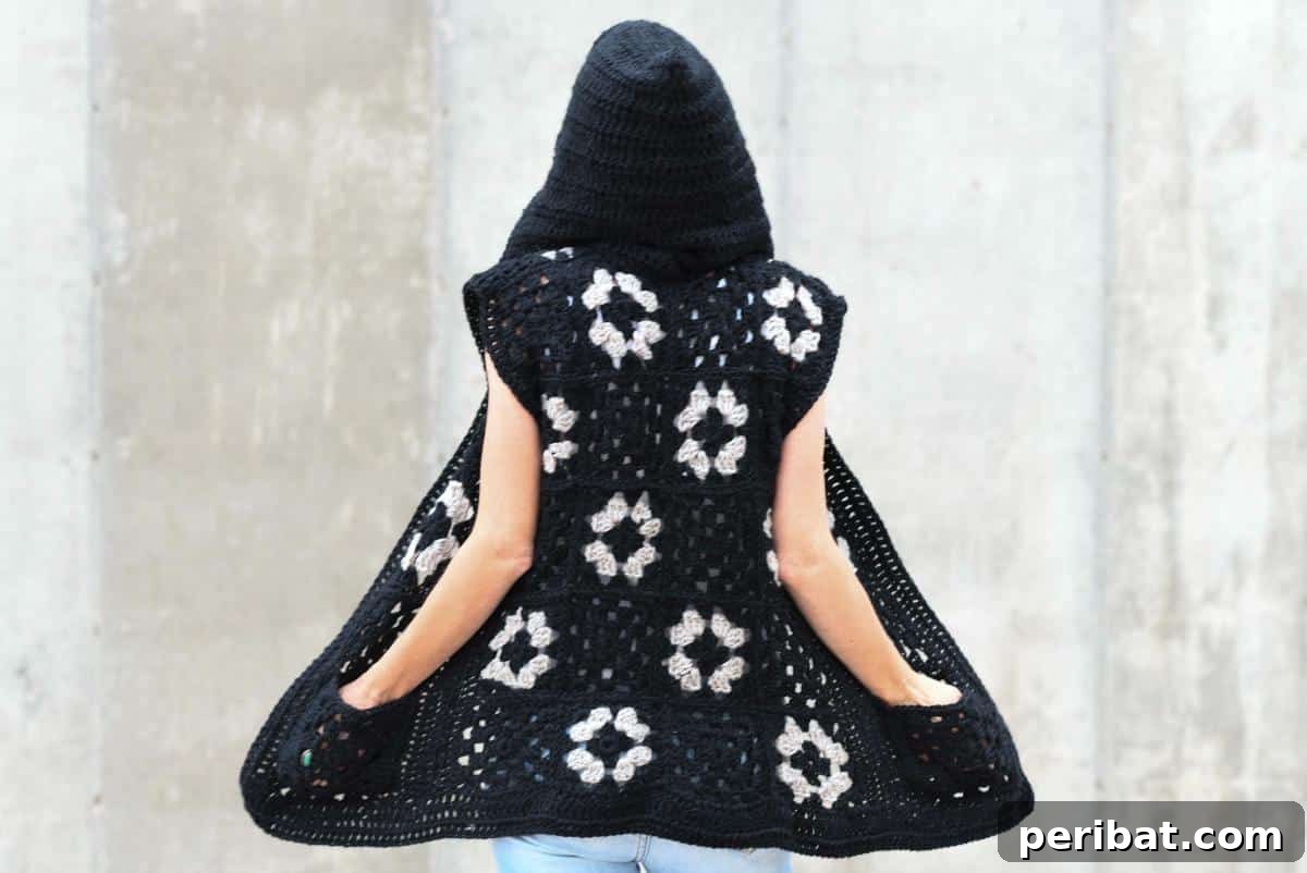 40 Chic Crochet Vest Designs 9 Hooded Granny Square Vest - A cozy and fashionable crochet vest pattern that combines the comfort of a hoodie with the classic granny square style.