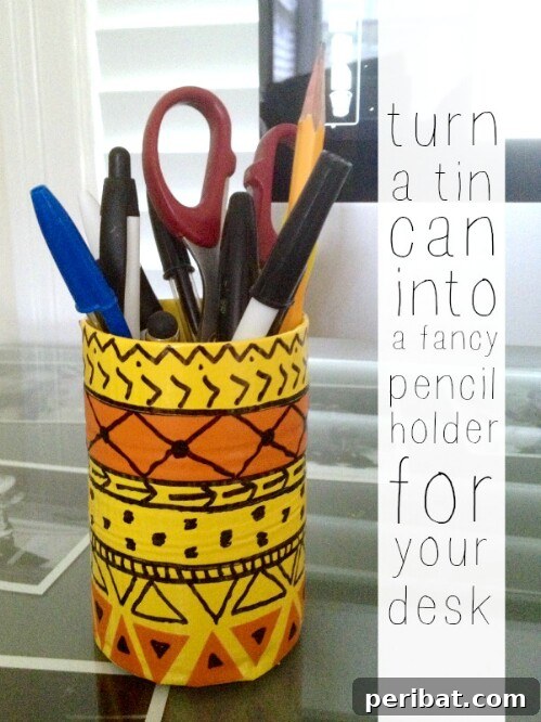 Tin Can Treasures: Transforming Recycled Metal into Stunning Home Decor 13 Decorated tin can pencil holder with a painted design