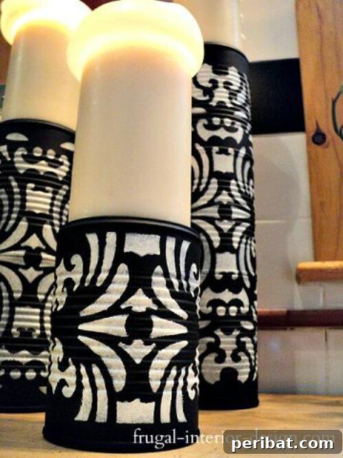 Tin Can Treasures: Transforming Recycled Metal into Stunning Home Decor 49 Decorated tin can pedestals for candles with stenciled designs
