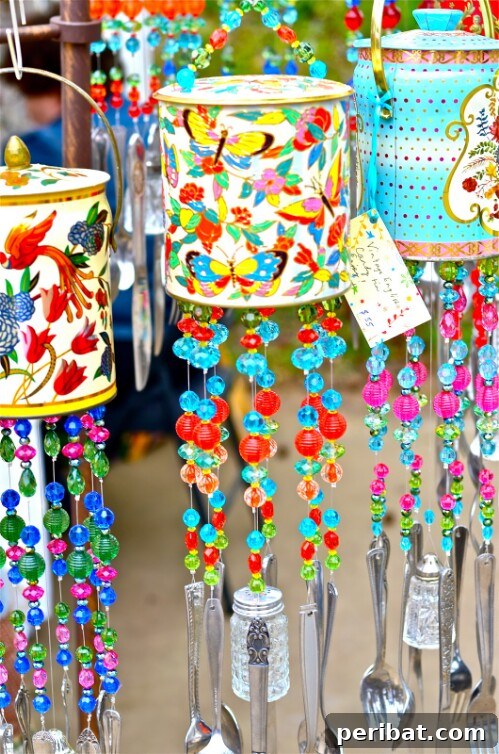 Tin Can Treasures: Transforming Recycled Metal into Stunning Home Decor 6 Colorful wind chimes made from painted tin cans, beads, and old utensils