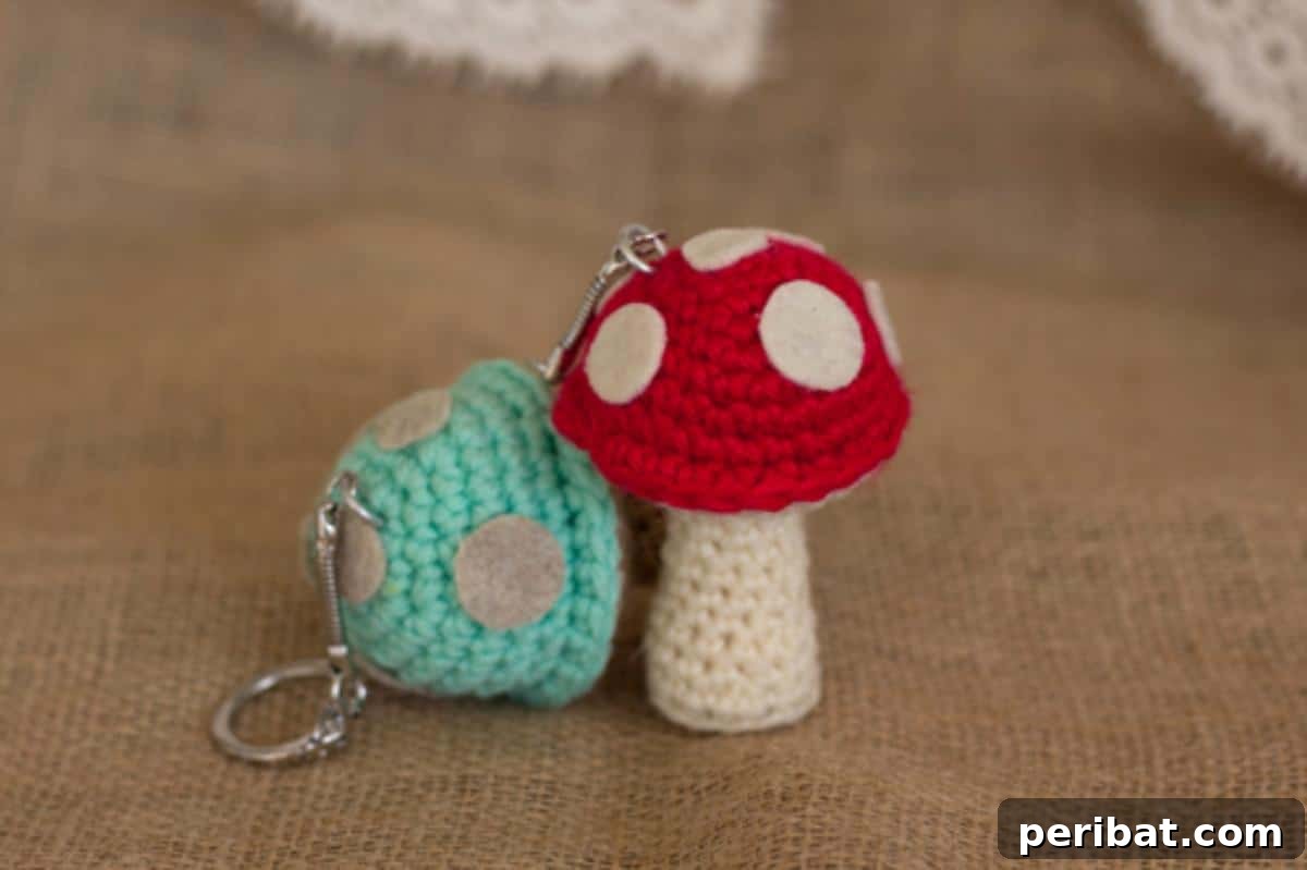 38 Adorable Crochet Keychain Patterns 23 Mushroom Keychains with red caps and white dots.