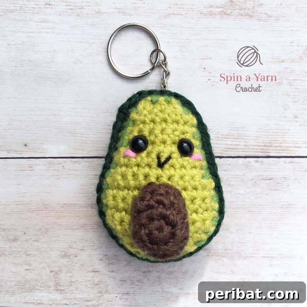 38 Adorable Crochet Keychain Patterns 4 Avocado Crochet Keychain featuring green and light brown yarn with a dark brown pit.