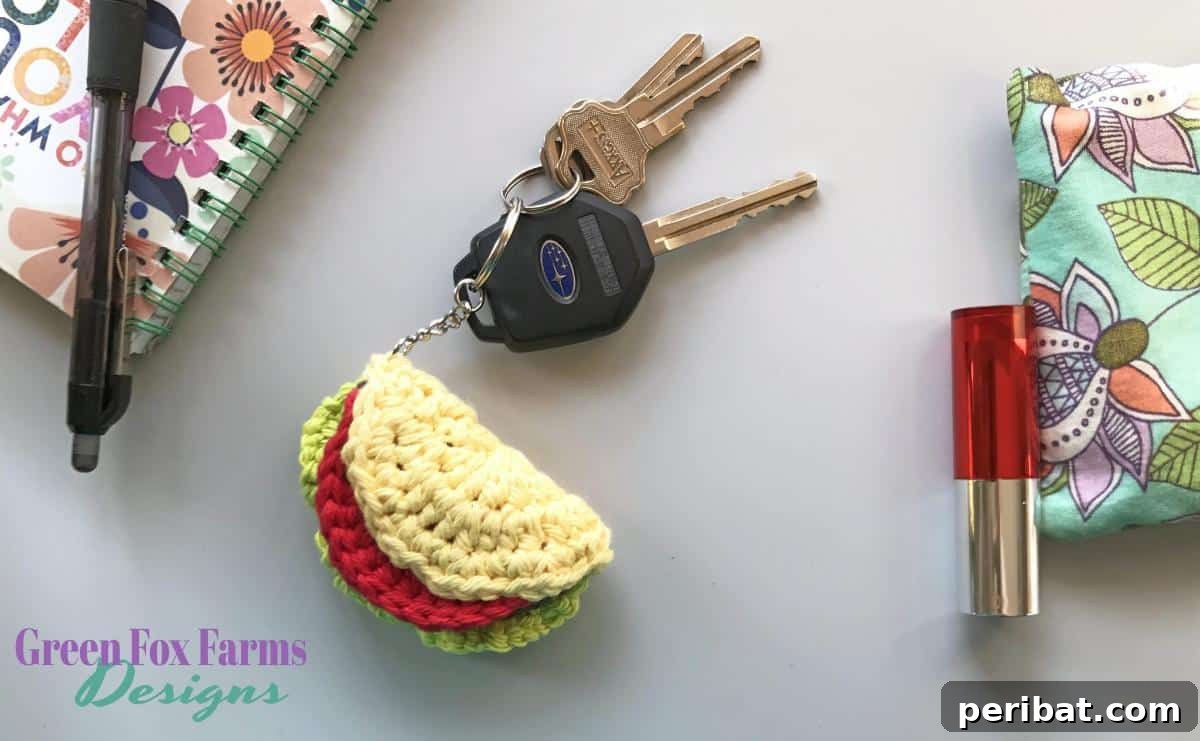 38 Adorable Crochet Keychain Patterns 6 Taco Keychain crafted from beige, green, red, and yellow yarn.
