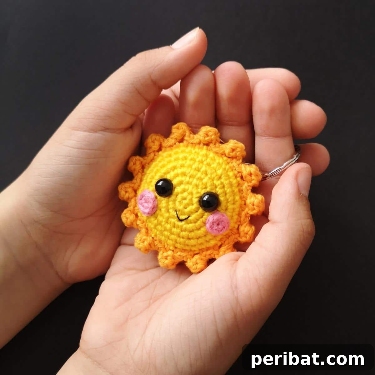 38 Adorable Crochet Keychain Patterns 8 Sun Crochet Keychain with bright yellow rays and a smiling face.