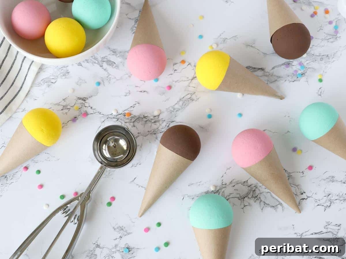 22 Creative Ice Cream Cone Projects for Summer Fun 11 A bright and cheerful ice cream cone craft for kids, made from paper and paint, featuring a colorful painted scoop on a textured paper cone, ready for display.