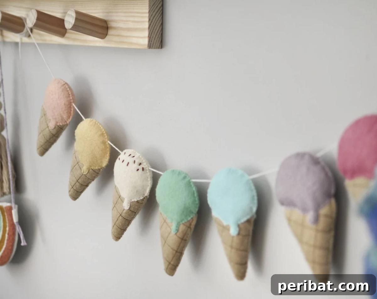 22 Creative Ice Cream Cone Projects for Summer Fun 20 A cozy felt ice cream garland, displaying multiple soft felt ice cream cones in various colors, hand-stitched and strung together for a warm, decorative touch.