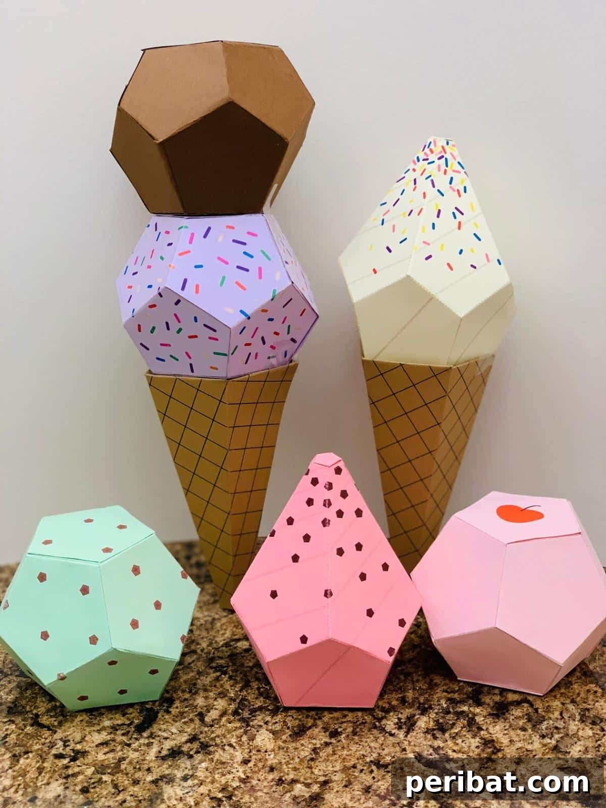 22 Creative Ice Cream Cone Projects for Summer Fun 24 A collection of versatile paper ice cream crafts, showcasing various styles of paper cones and scoops, decorated with different patterns and textures, perfect for a wide range of creative projects.
