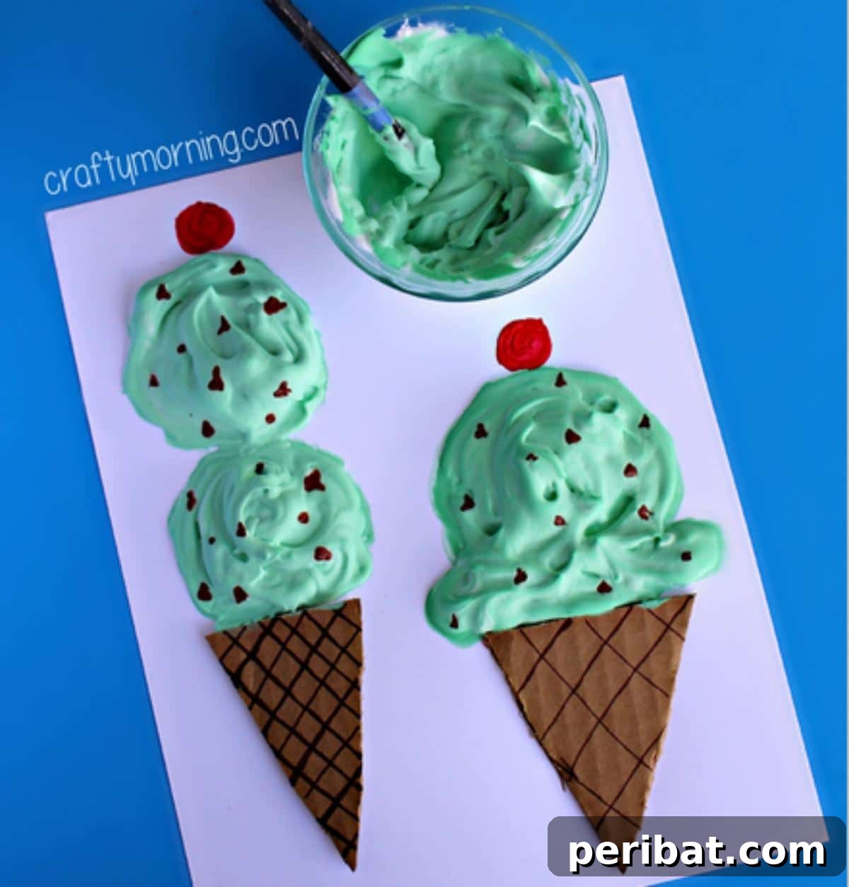 22 Creative Ice Cream Cone Projects for Summer Fun 4 A colorful puffy paint ice cream cone craft, showing raised, textured 'scoops' in various pastel colors on a paper cone, ideal for sensory play and creative expression for kids.