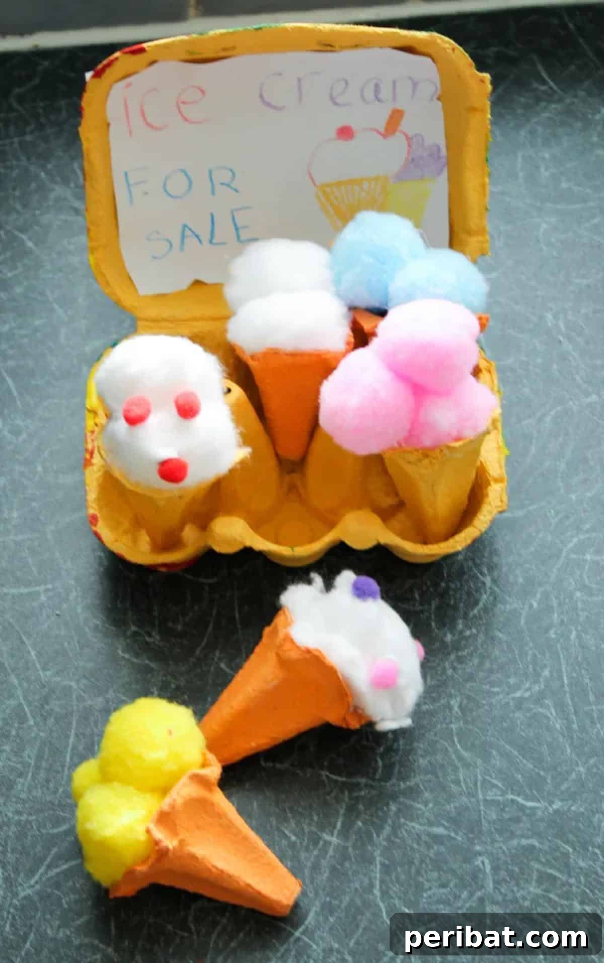 22 Creative Ice Cream Cone Projects for Summer Fun 7 Crafted egg carton ice cream cones, demonstrating how upcycled egg carton sections can be painted and decorated to resemble ice cream scoops on paper cones, promoting eco-friendly crafting.