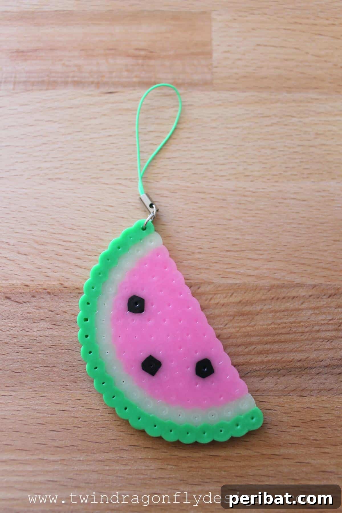 39 Juicy Watermelon Craft Ideas 17 Charming watermelon Perler bead keychain, a fun and easy craft for personalizing accessories.