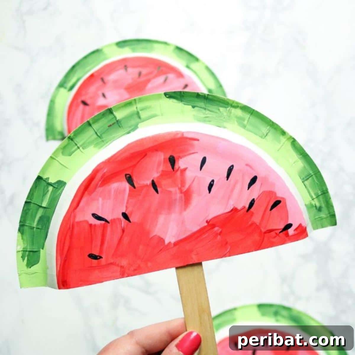 39 Juicy Watermelon Craft Ideas 18 Handmade watermelon paper plate fans, featuring cheerful designs, perfect for beating the summer heat.