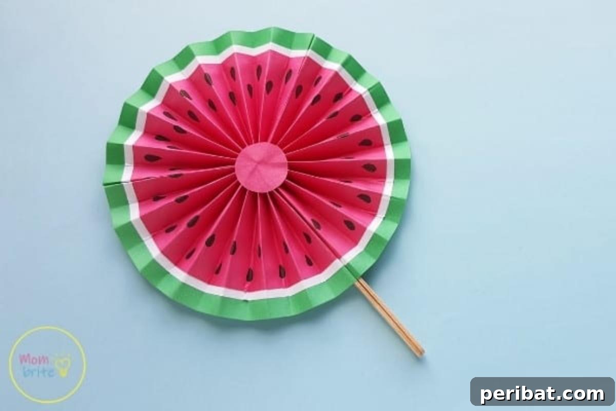 39 Juicy Watermelon Craft Ideas 23 Simple and fun easy watermelon paper fan craft for kids, perfect for staying cool in summer.