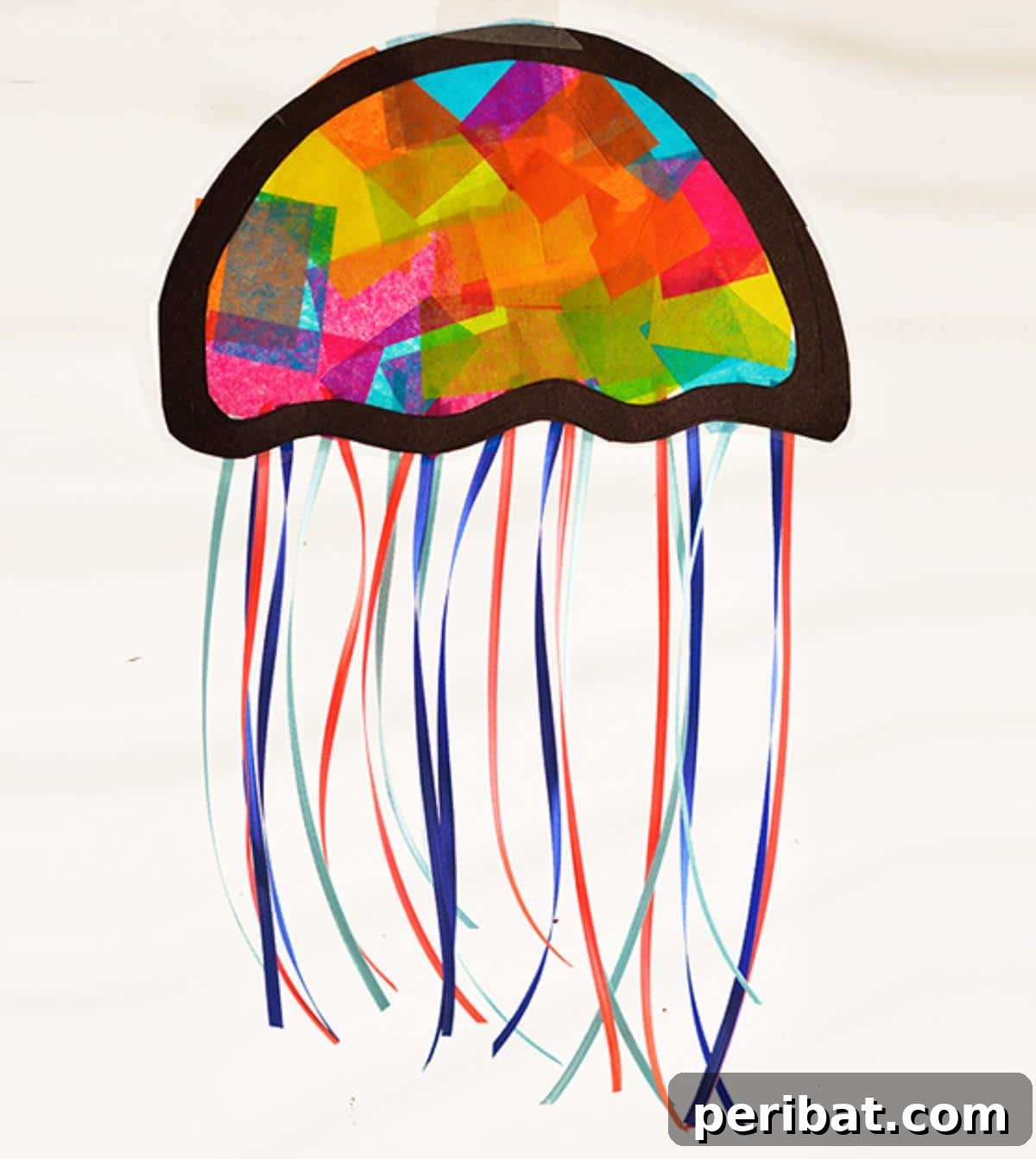 23 Vibrant DIY Tissue Paper Suncatcher Projects 14 A blue and purple jellyfish suncatcher with flowing tissue paper tentacles, creating an underwater effect.
