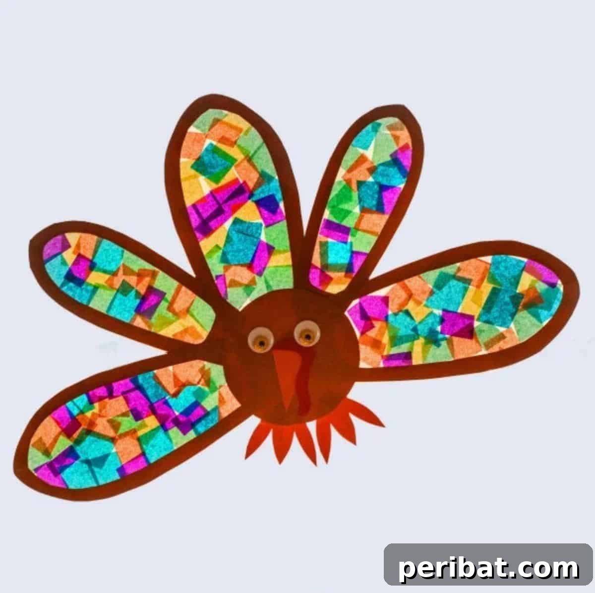 23 Vibrant DIY Tissue Paper Suncatcher Projects 16 A colorful turkey suncatcher made with various shades of tissue paper, designed for Thanksgiving.