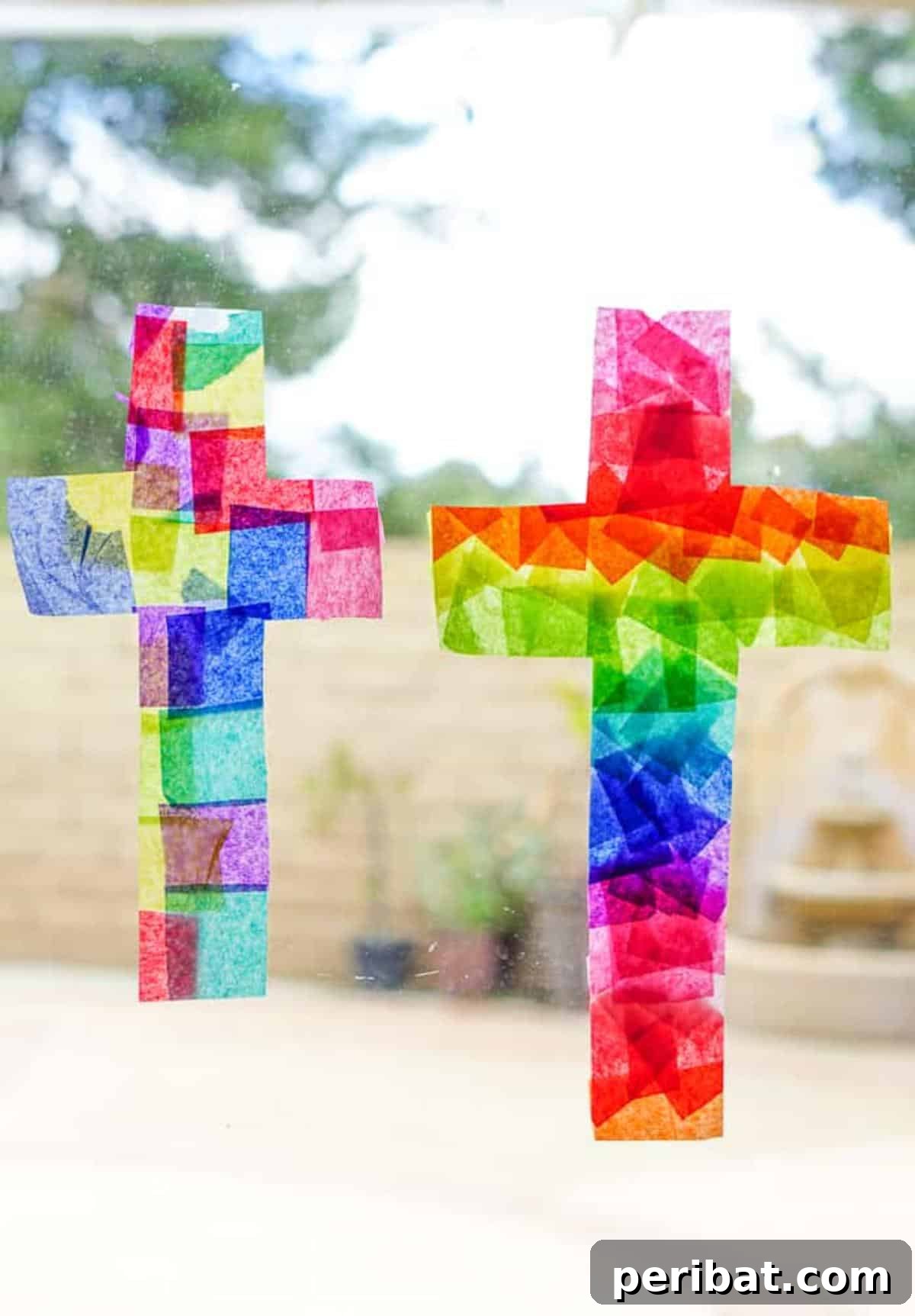 23 Vibrant DIY Tissue Paper Suncatcher Projects 19 An Easter-themed suncatcher featuring a bunny and an egg, made with pastel-colored tissue paper.