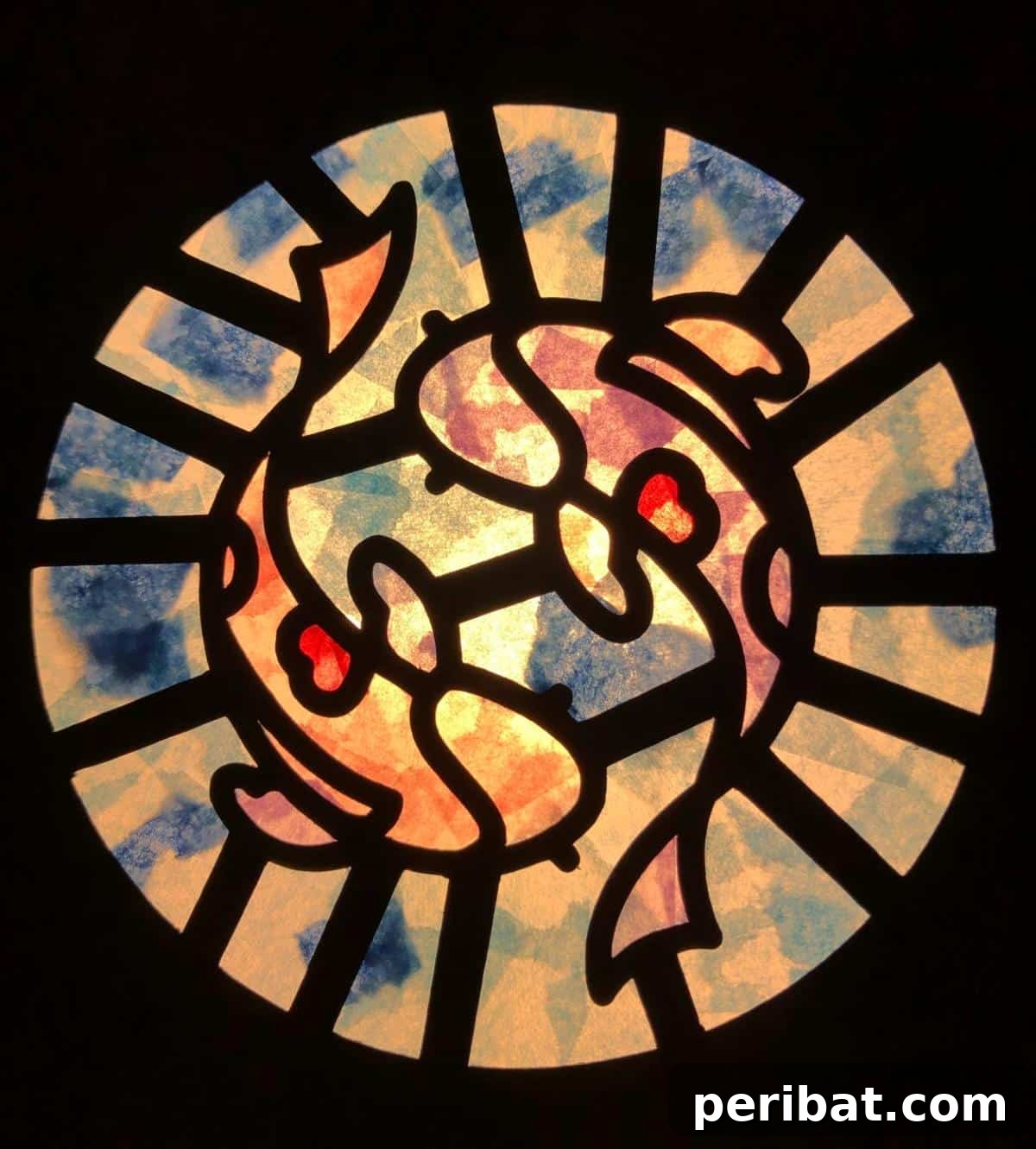 23 Vibrant DIY Tissue Paper Suncatcher Projects 22 A delicate tissue paper stained glass suncatcher with a Japanese-style design, possibly a blossom or landscape.